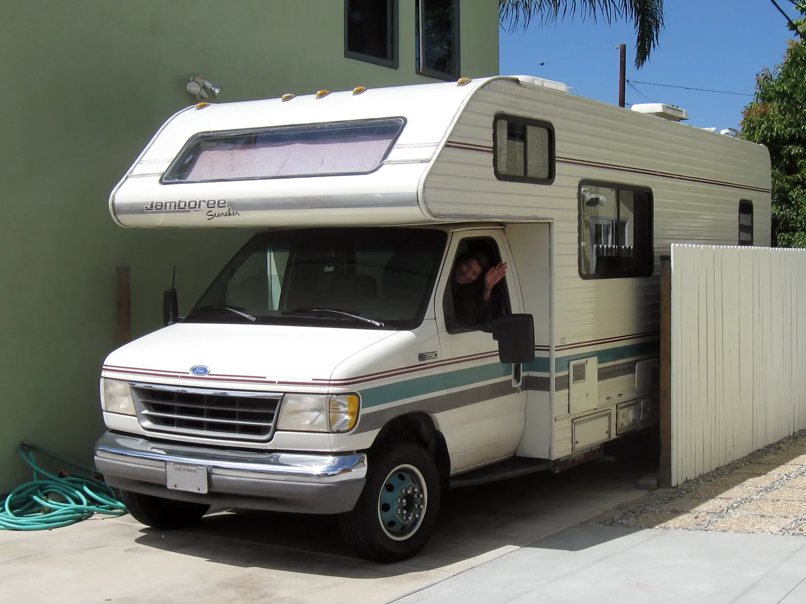 A motorhome parked in a home driveway. The picture was not taken in Alpharetta.