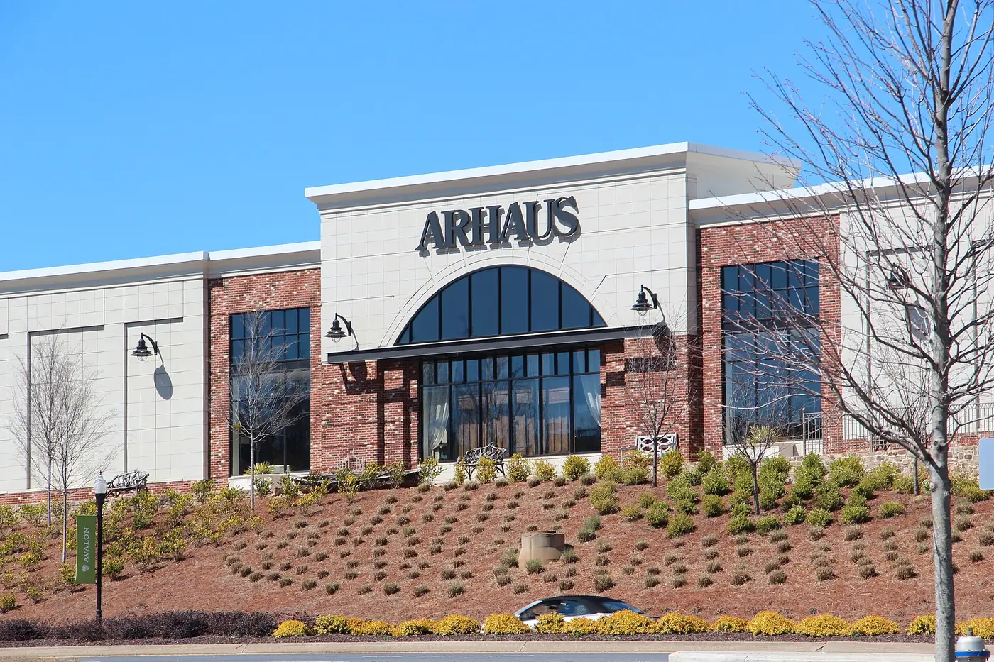 The Arhaus furniture store at Avalon in Alpharetta, beside an Avalon street banner