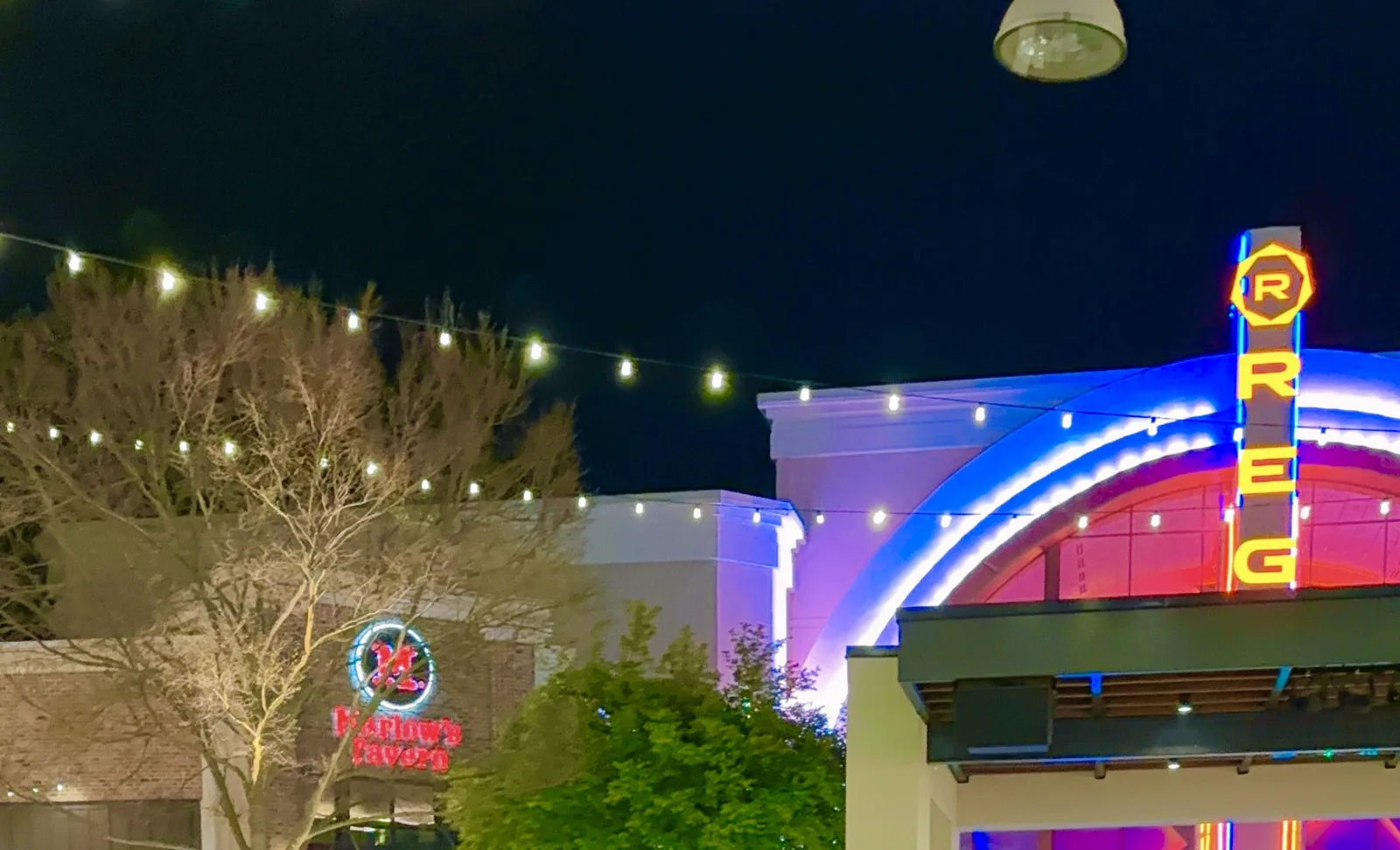 String lights and the Regal marquee over The Plaza at Avalon in Alpharetta at night.
