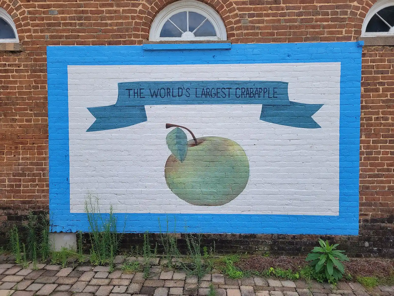 The World's Largest Crabapple mural in Crabapple, a few hundred yards from the school, photographed in 2025