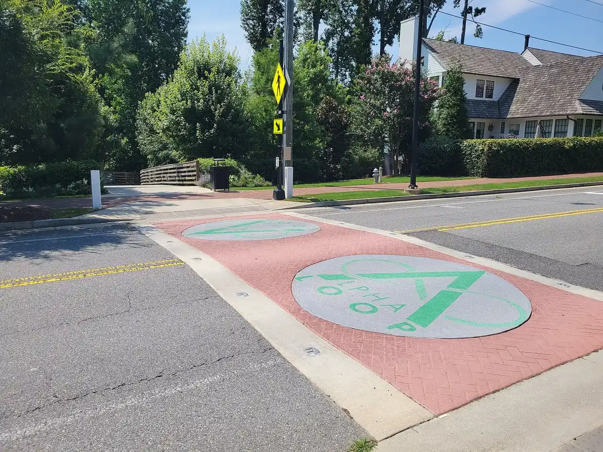 An Alpha Loop crosswalk in Alpharetta, about a mile southwest of the school, photographed in 2025
